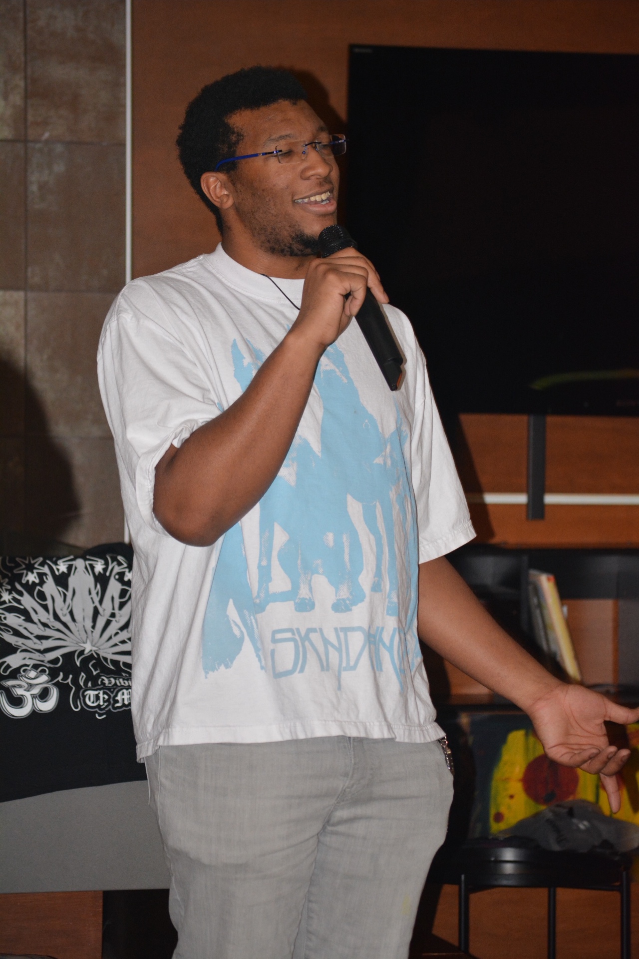 Valden Campbell speaking during a live performance.